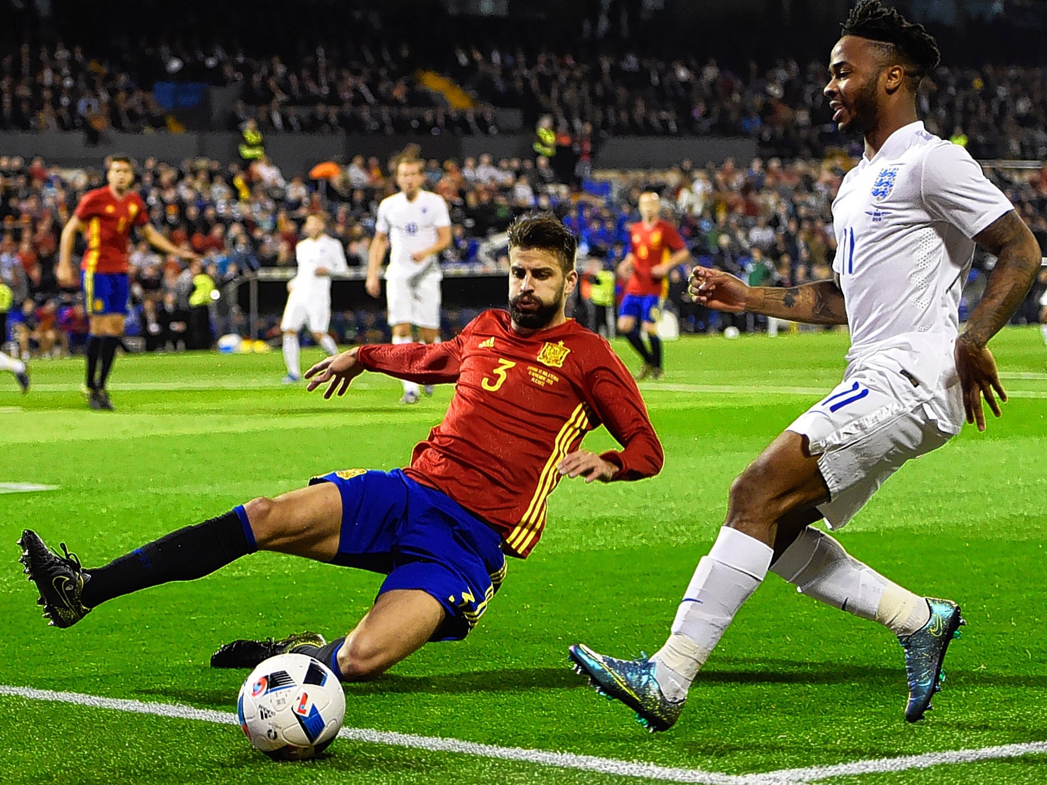 Spain defender Gerard Pique in action against England