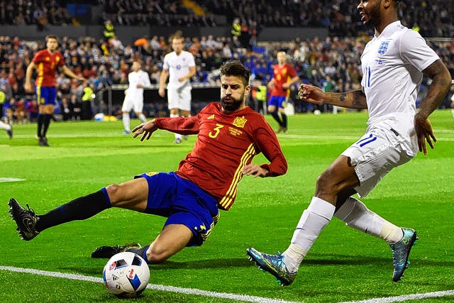 Spain defender Gerard Pique in action against England