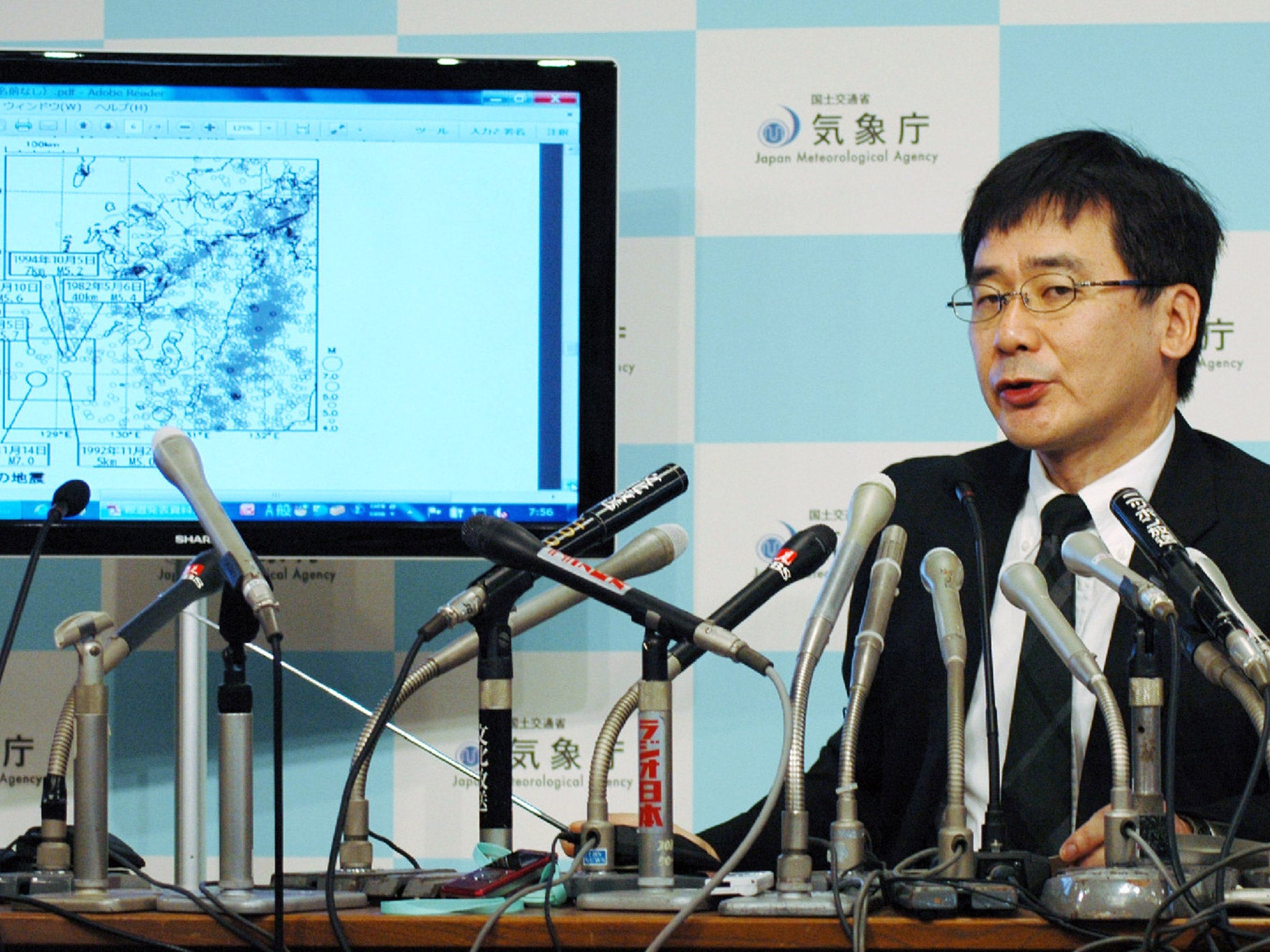 Japan Meteorological Agency earthquake expert Koji Nakamura speaks during a press conference at the meteorological Agency in Tokyo