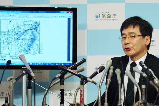 Japan Meteorological Agency earthquake expert Koji Nakamura speaks during a press conference at the meteorological Agency in Tokyo