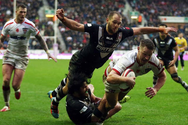 England's Elliott Whitehead scores a try against New Zealand