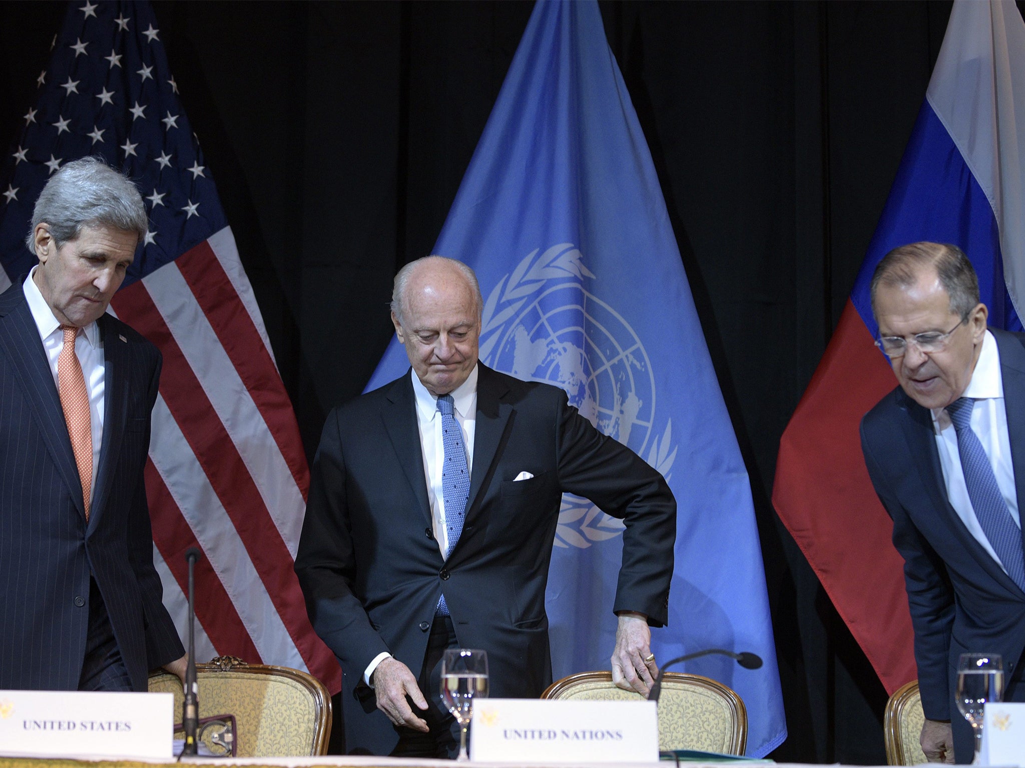 Secretary of State John Kerry, United Nations Special Envoy for Syria Staffan de Mistura and Russian Foreign Minister Sergei Lavrov, during a news conference after an international conference on Syria, in Vienna,