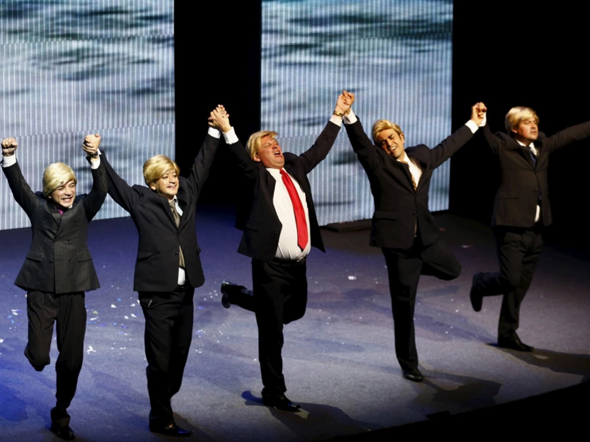 Mexican comics, one of them dressed as U.S. Republican presidential candidate Donald Trump poke fun at the candidate during a show entitled "Sons of Trump" at the Aldana theater in Mexico City