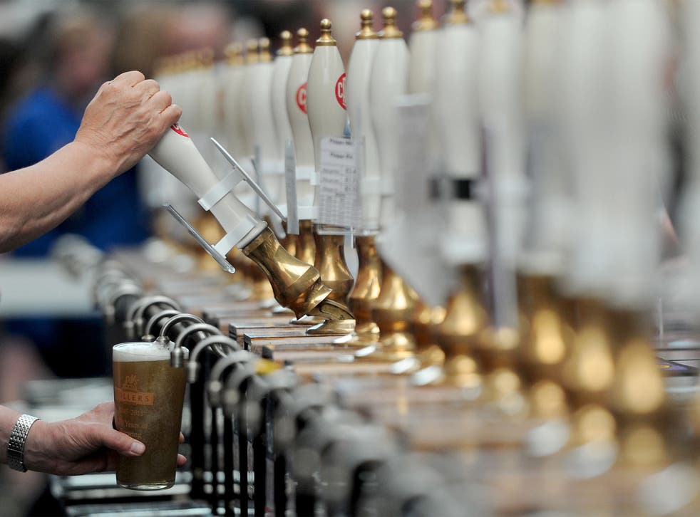 A drink is poured during the annual Great British Beer Festival organised by the Campaign for Real Ale (CAMRA) at Olympia in London