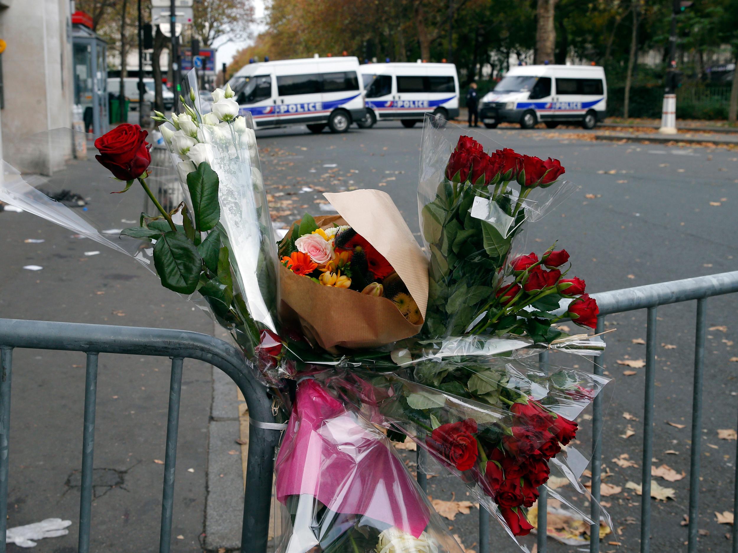 Flowers are placed outside the Bataclan concert hall on Saturday 14 November