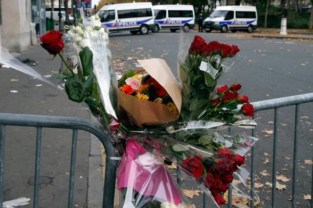 Flowers are placed outside the Bataclan concert hall on Saturday 14 November