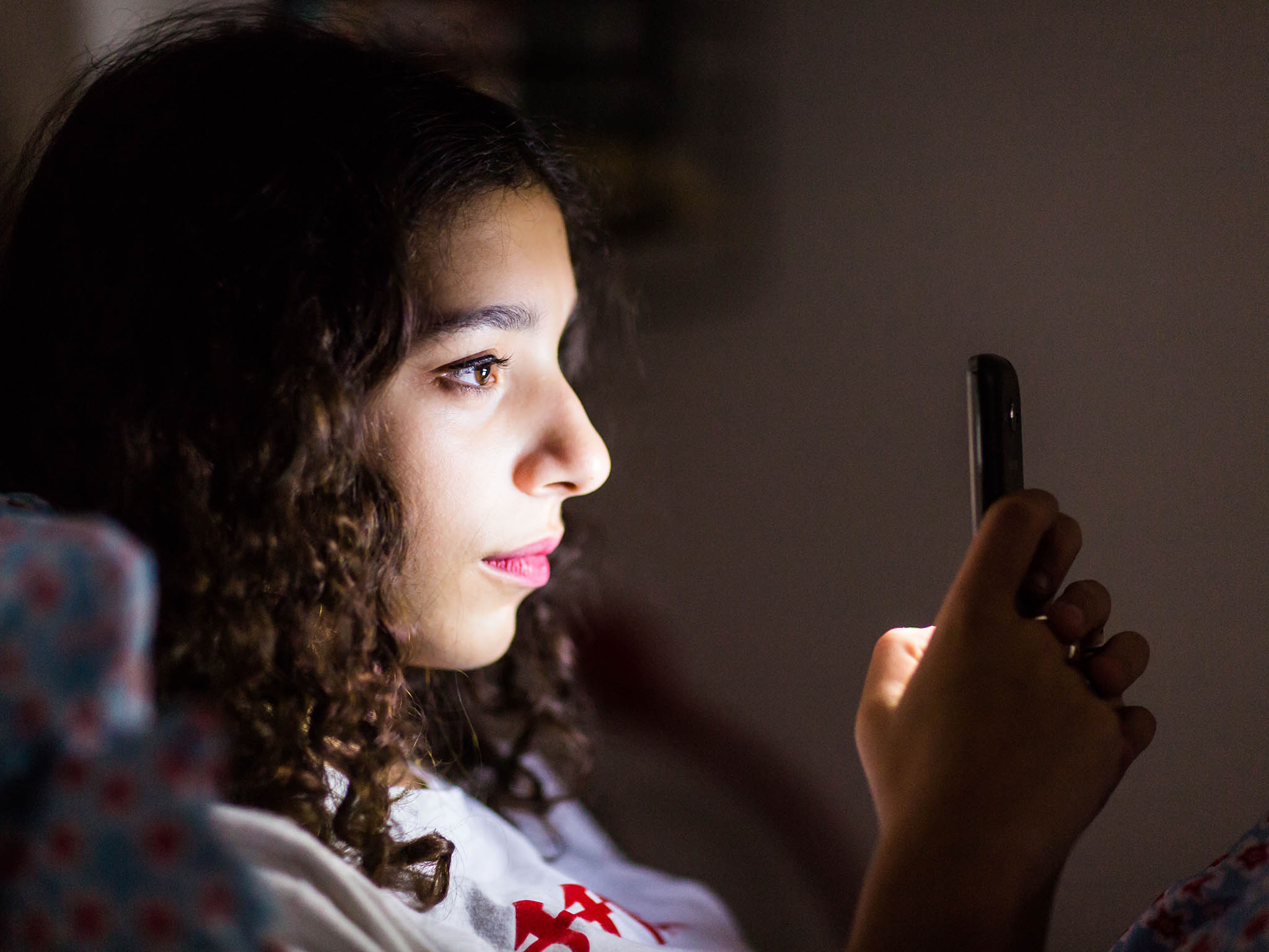 Using devices at night-time that give out rays of blue light make it harder for us to get to sleep.