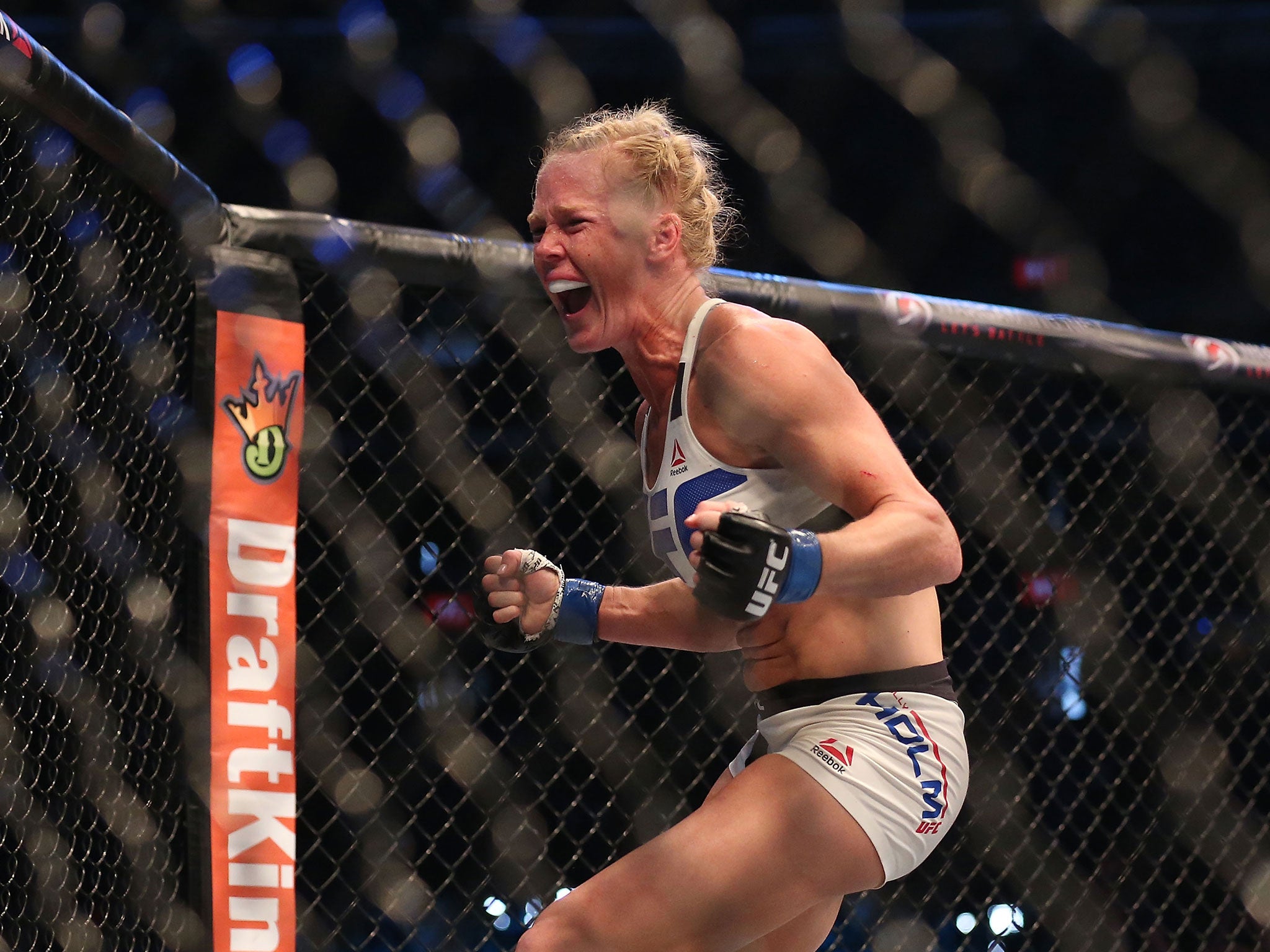 Holly Holm celebrates her victory over Ronda Rousey