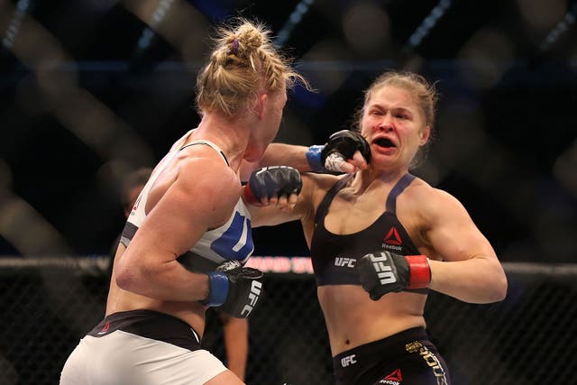 Holly Holm catches Ronda Rousey with a left hook
