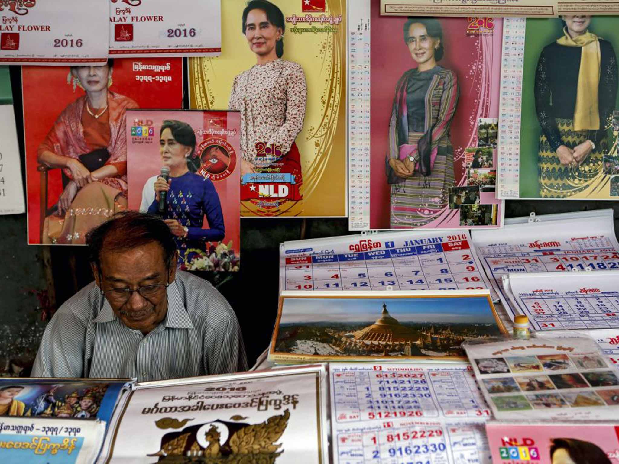 Aung San Suu Kyi calendars and posters on display in a shop in Rangoon