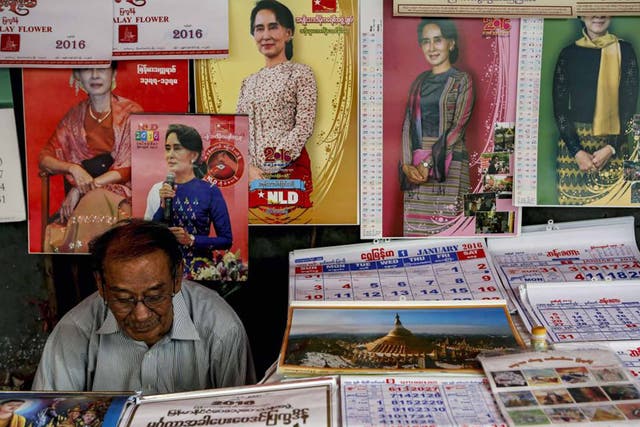 Aung San Suu Kyi calendars and posters on display in a shop in Rangoon