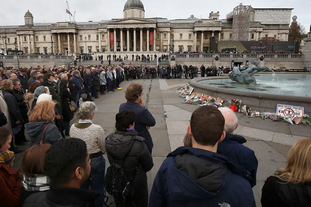 People in Trafalgar Square, London, during a minute's silence across Europe to mark the victims of attacks in the French capital