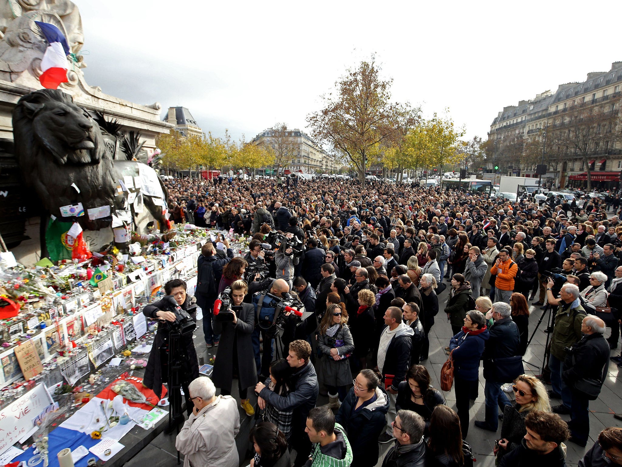 Crowds gather in the Place de la Republique, Paris to observe a minute's silence across Europe to mark the victims of the attacks in the French capital