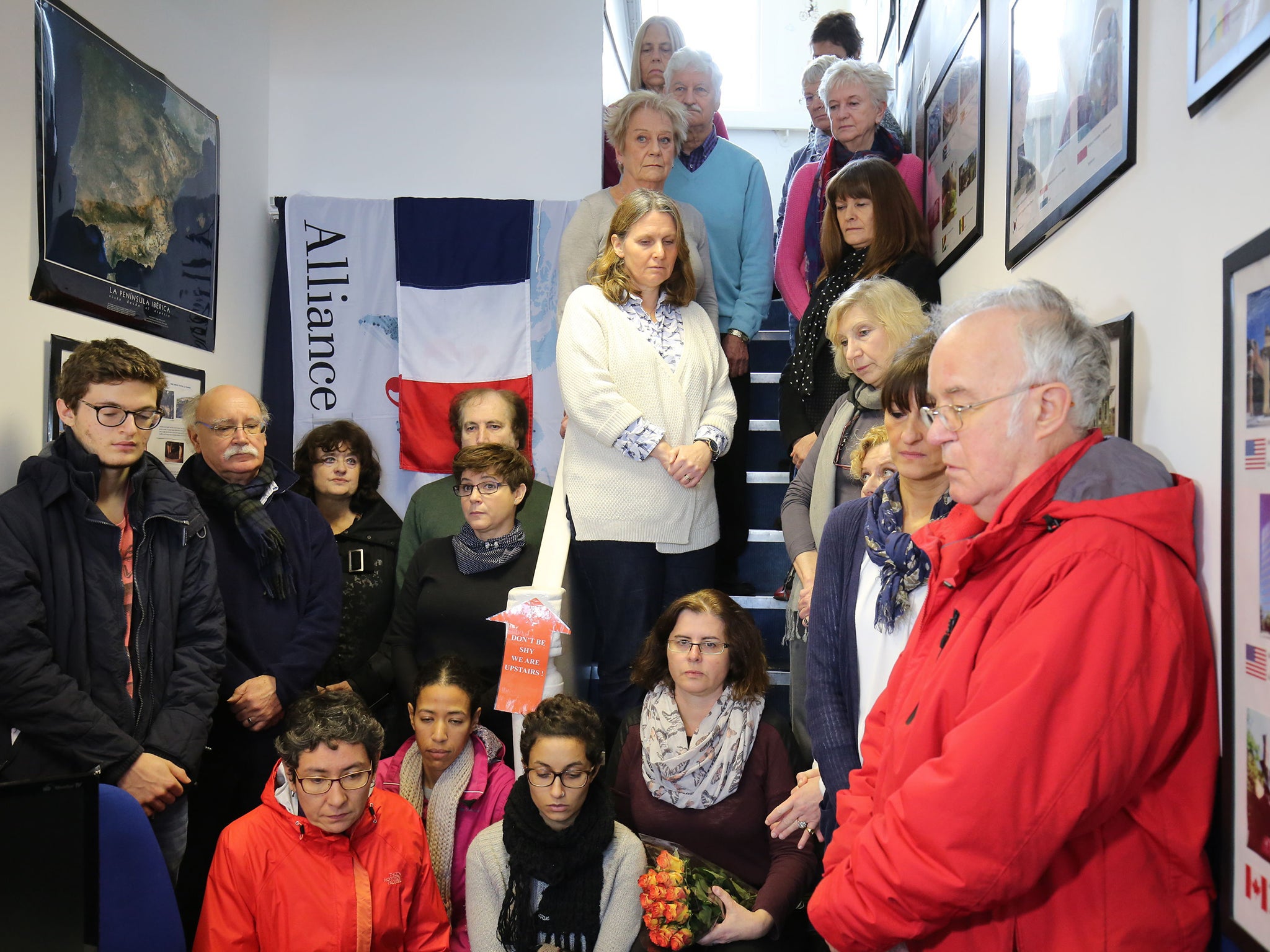 People inside the Alliance Franaise de Cambridge in Cambridge during a minute's silence to mark the victims of the attacks in the French capital