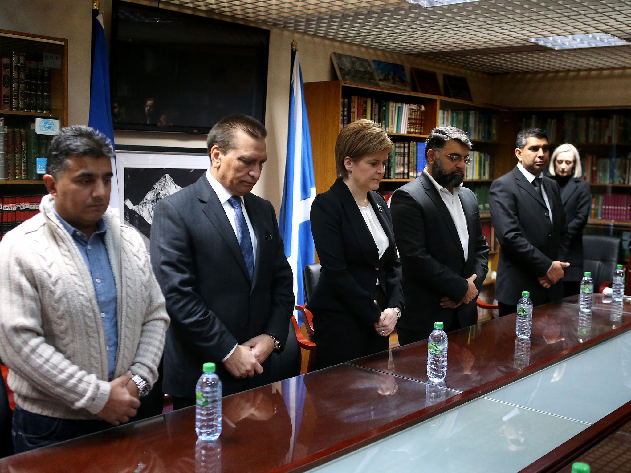 Mosque President Maqbool Rasul (second left) with Scotland First Minister Nicola Sturgeon and Mosque Secretary Nabeel Sheikh (fourth left) as they observe a minute's silence across Europe to mark the victims of attacks in Paris