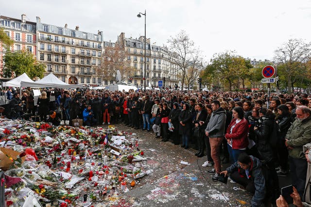 Thousands of people observe a minute of silence near the Bataclan in Paris
