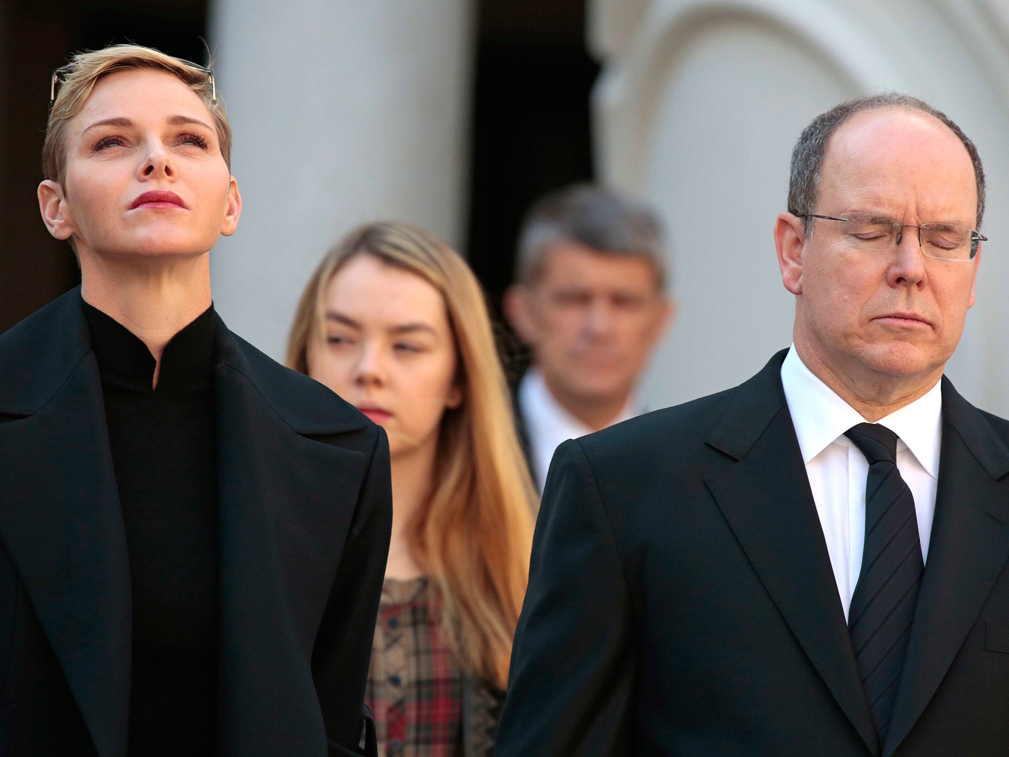 Prince Albert II of Monaco and Princess Charlene observe a minute of silence as they pay tribute to the victims of the Paris attacks, at Monaco Palace