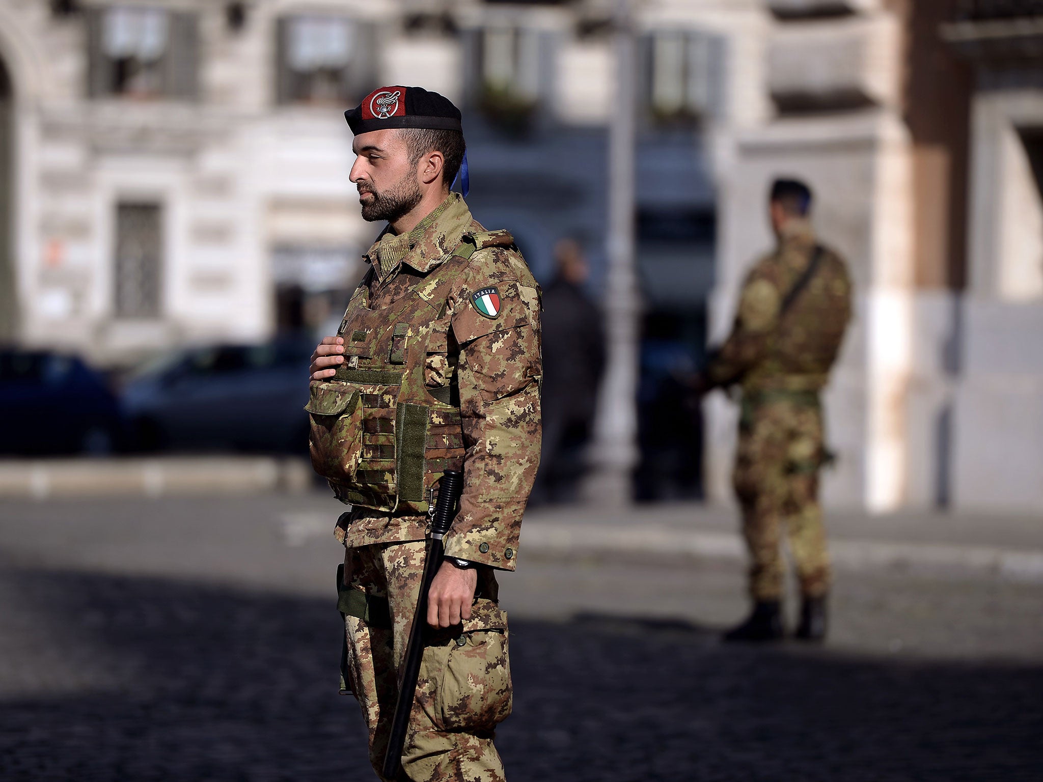 Italian soldiers patrol near the San Giovanni Basilica in Roma on November 16, 2015