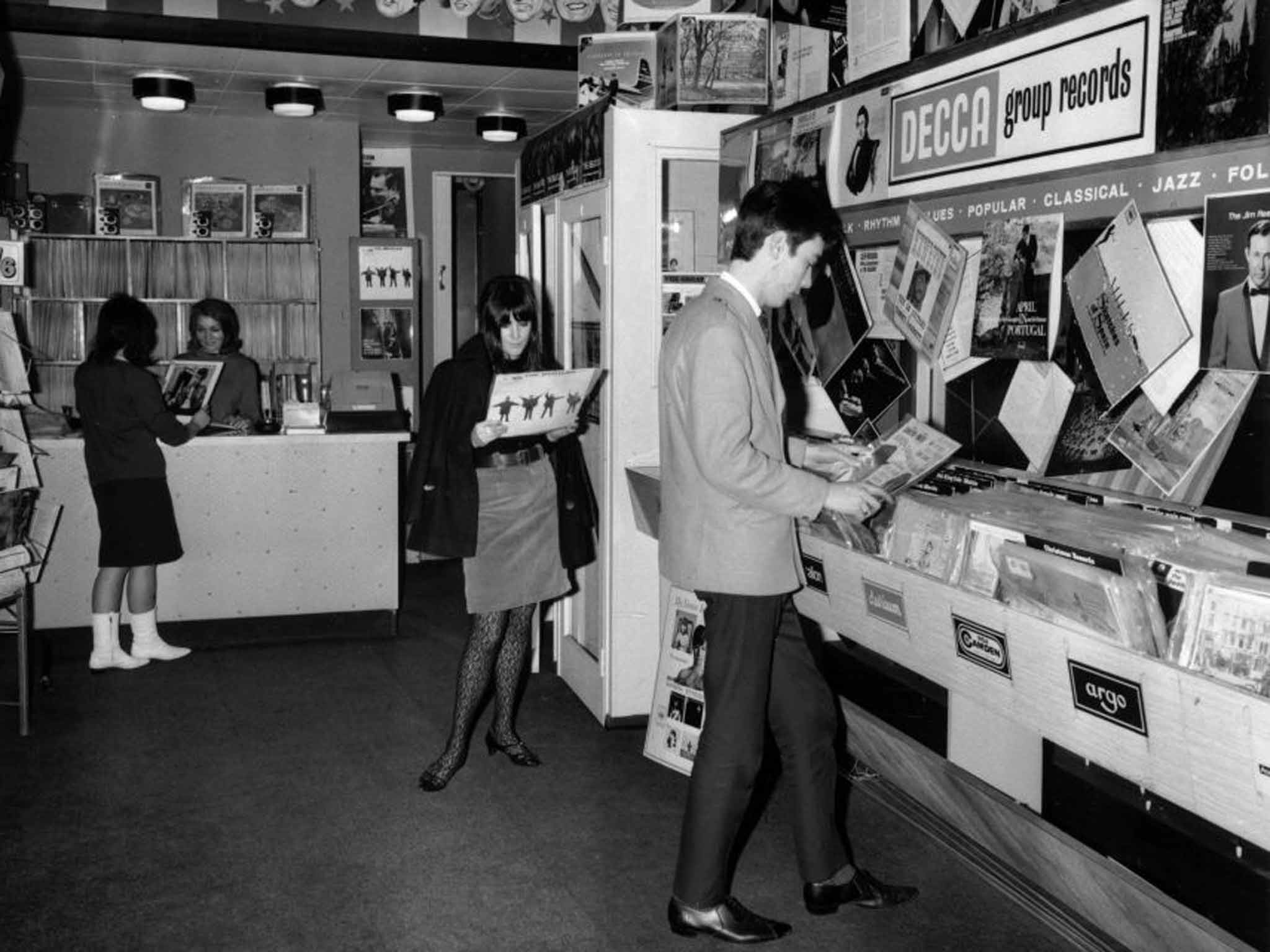 The way we were: teenagers looking at the latest albums in a record shop, 1965