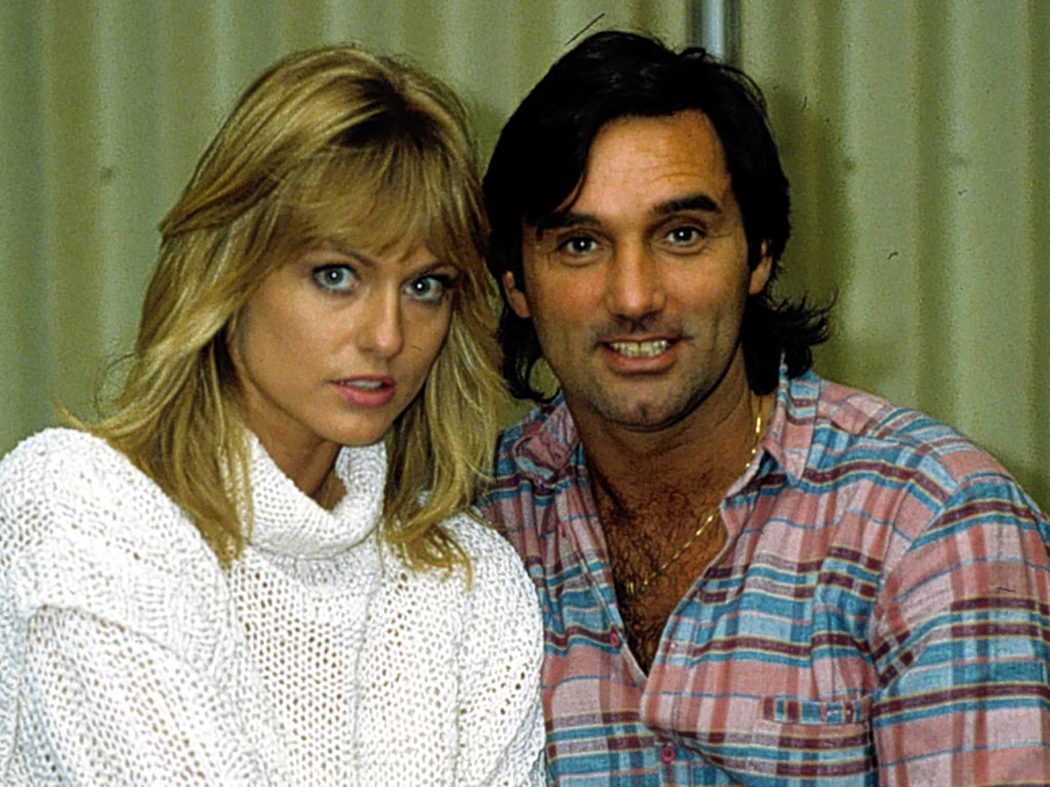 Chain reaction: George Best with the former Miss World Mary Stavin in 1983