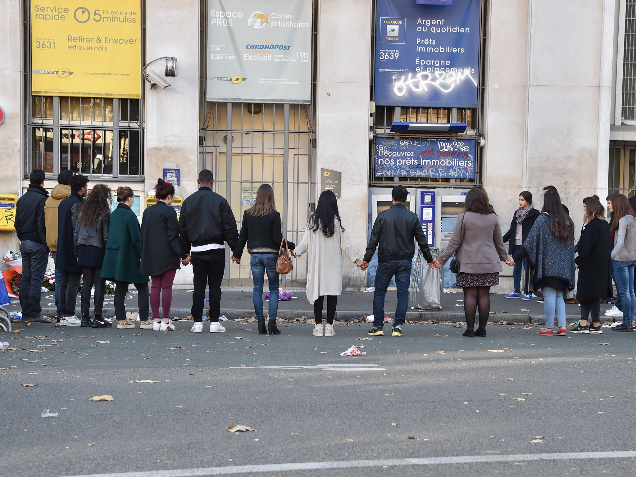 Mourners gathered outside the Bataclan concert hall in Paris