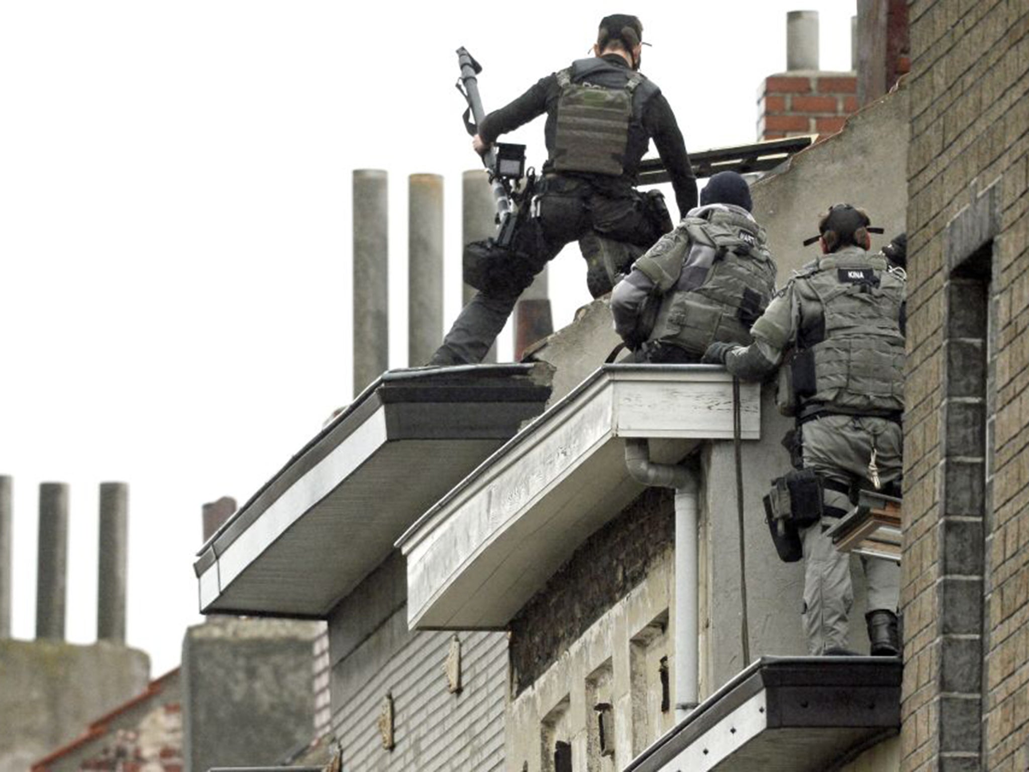 Special forces outside a house being searched in Brussels on Monday