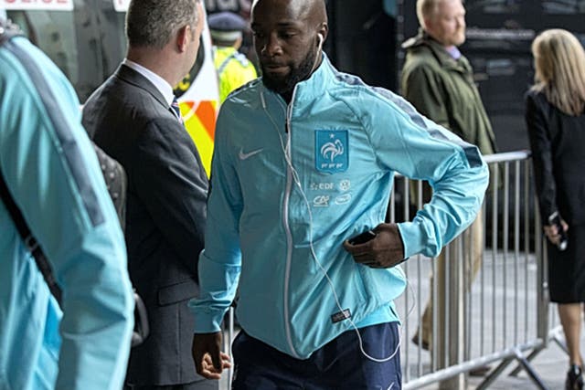 France midfielder Lassana Diarra, whose cousin was killed in the Paris attacks, arrives at the team’s London hotel