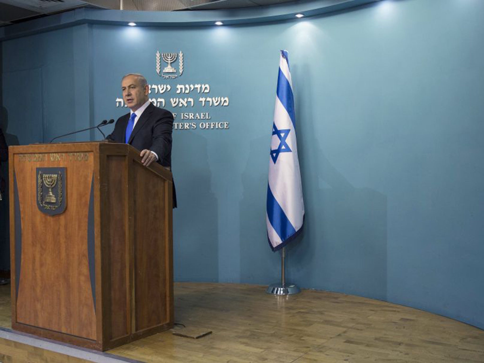 Israel's Prime Minister Benjamin Netanyahu delivers a statement to the media following the attacks in Paris