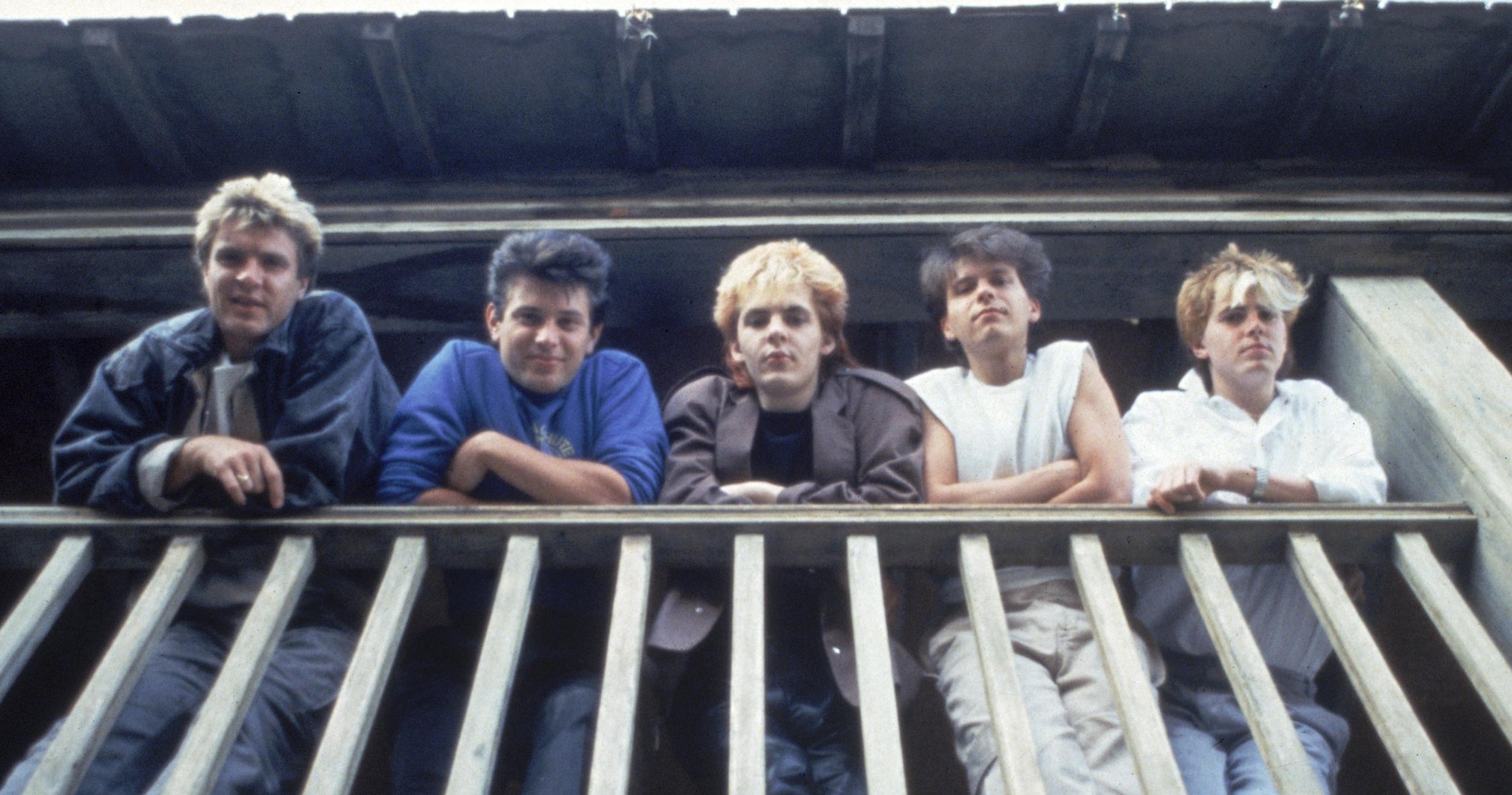 Duran Duran posing on a balcony