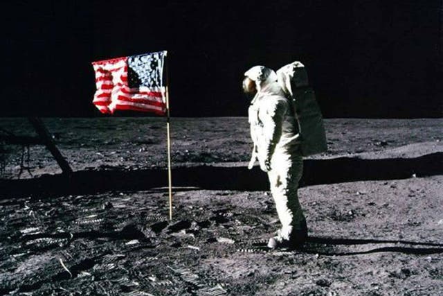 In the shadows: Conspiracy theorists said this photo of Apollo 11 astronaut Edwin ‘Buzz’ Aldrin standing by the US flag planted on the surface of the Moon on 20 July 1969 was mocked up