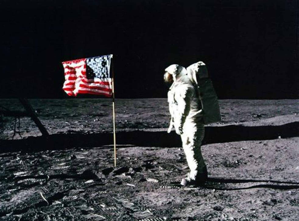 In the shadows: Conspiracy theorists said this photo of Apollo 11 astronaut Edwin ‘Buzz’ Aldrin standing by the US flag planted on the surface of the Moon on 20 July 1969 was mocked up