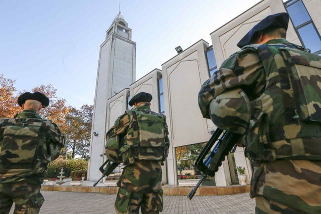 French paratroopers patrol outside the Great Mosque in Lyon