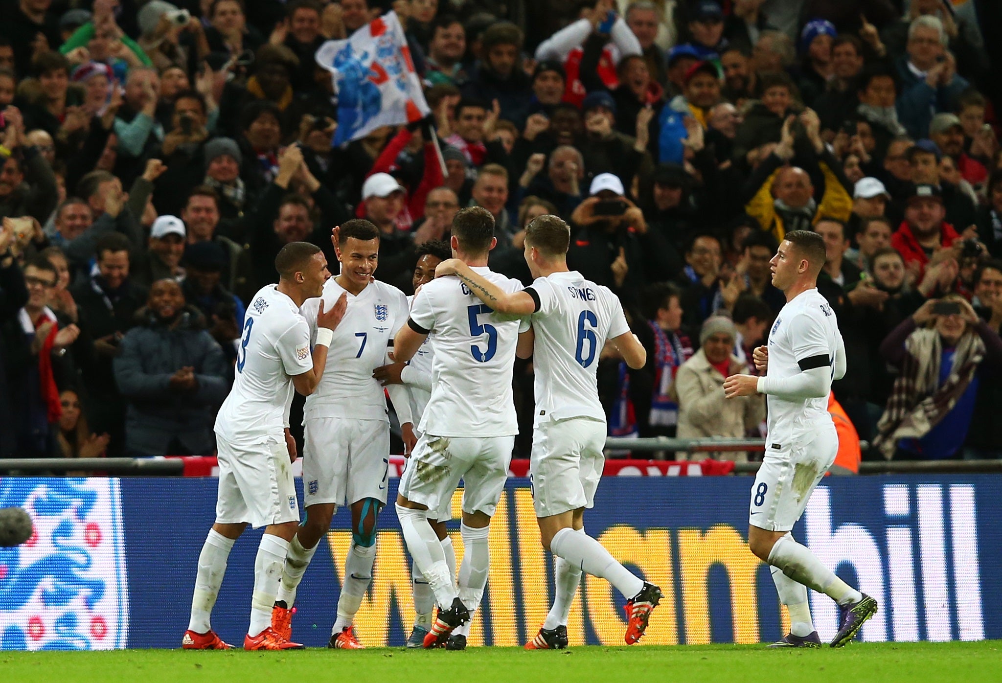 England players celebrate after Del Alli scores against France