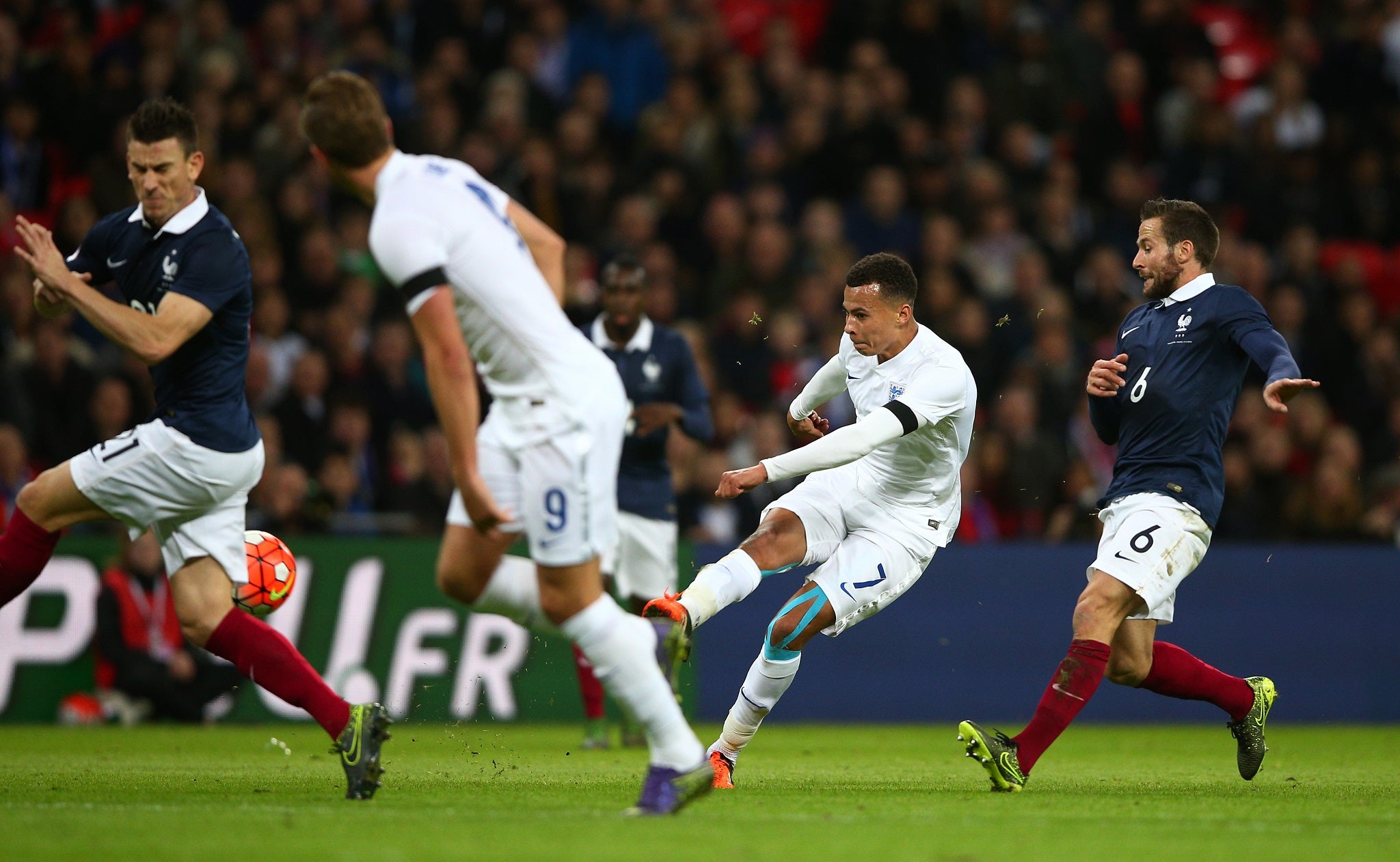 Dele Alli shoots to score the first goal for England against France