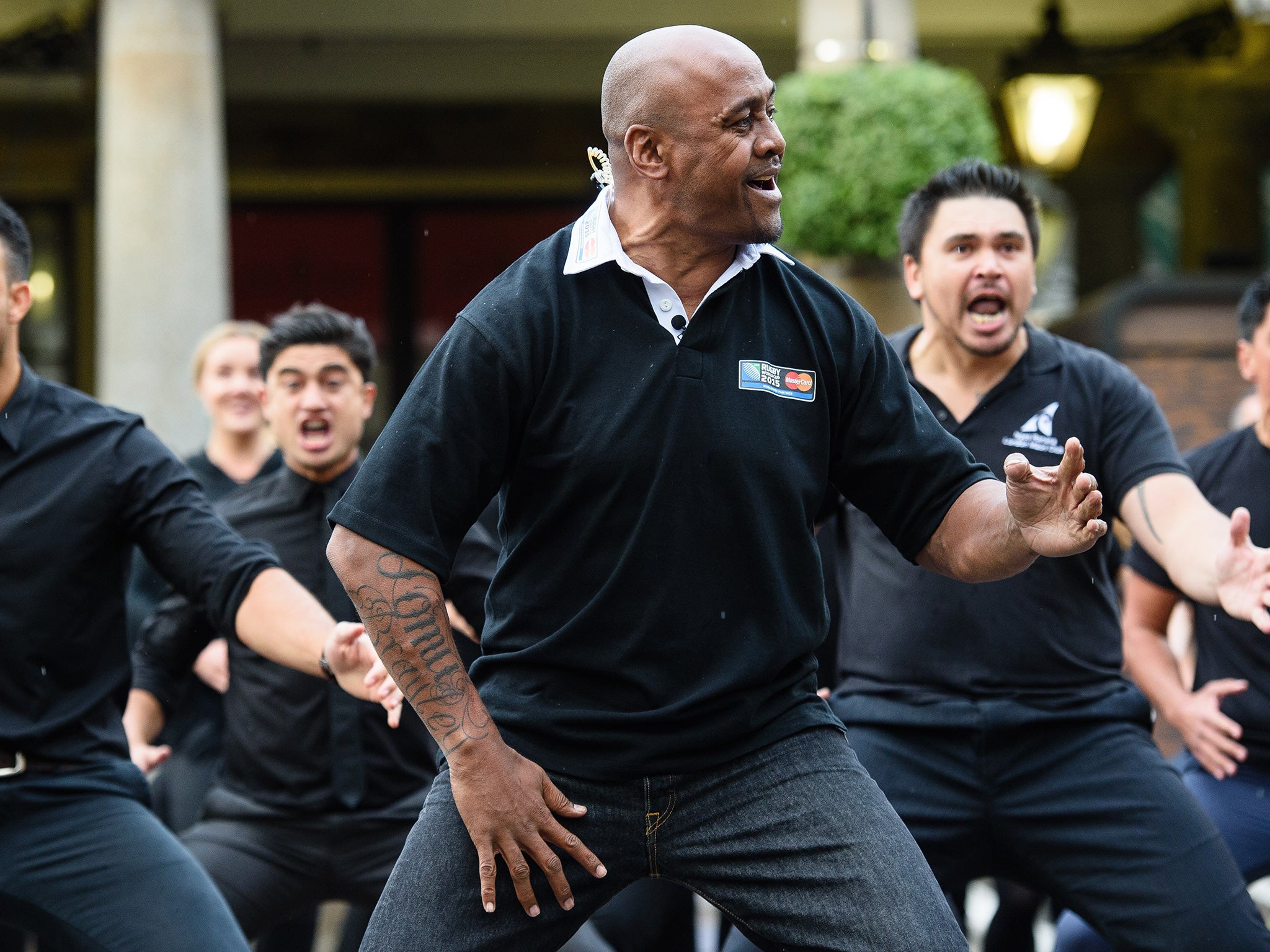 Former New Zealand rugby union player Jonah Lomu (C) and members of the Ngati Ranana London Maori Club take part in a haka