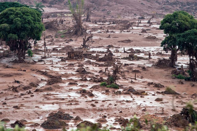 Aerial view after a dam burst in the village of Bento Rodrigues, in Mariana, Minas Gerais state, Brazil on November 6, 2015. The mining company Samarco, which operates the site, is jointly owned by two mining giants, Vale of Brazil and BHP Billiton of Australia.