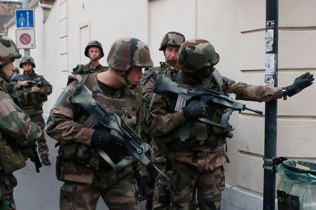 Police say two suspects in last week's Paris attacks, a man and a woman, have been killed