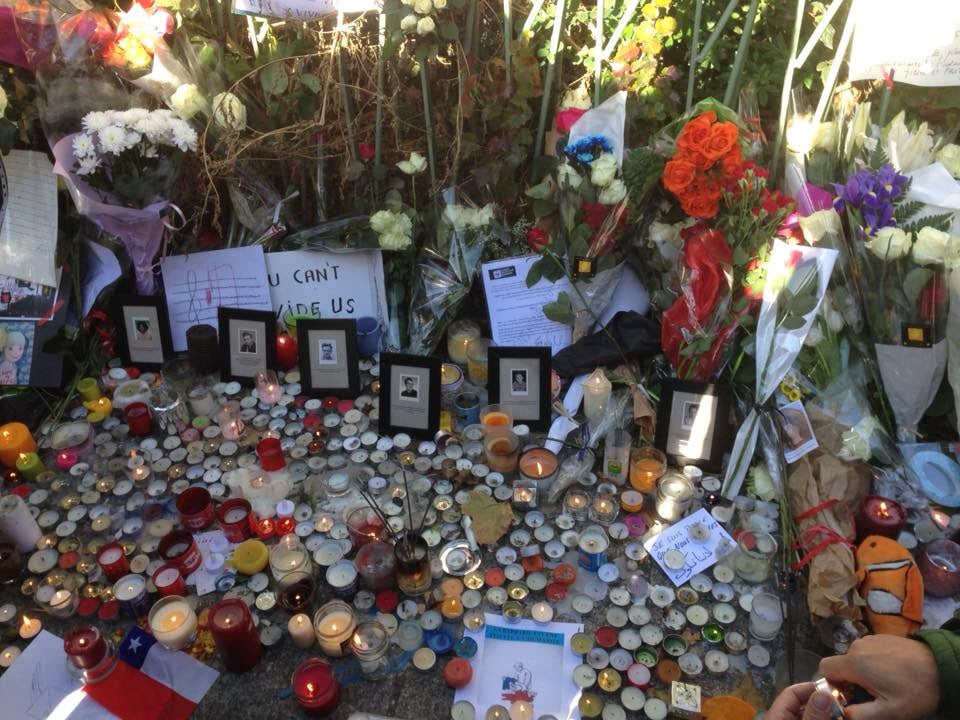 Roadside memorial outside the Bataclan mourning the 89 music fans who died.