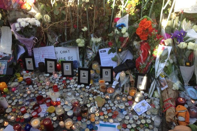 A roadside memorial at the Bataclan, where the mobile phone is thought to have been found