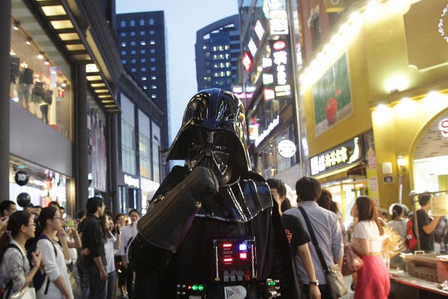 A South Korean man dressed in a Darth Vader during the 'Star Wars - Force Friday' in Myeongdong shopping district on September 4, 2015 in Seoul, South Korea.