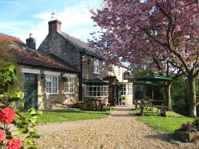 The old pub, built around the time that Henry VIII sacked the abbey, is embedded in the landscape