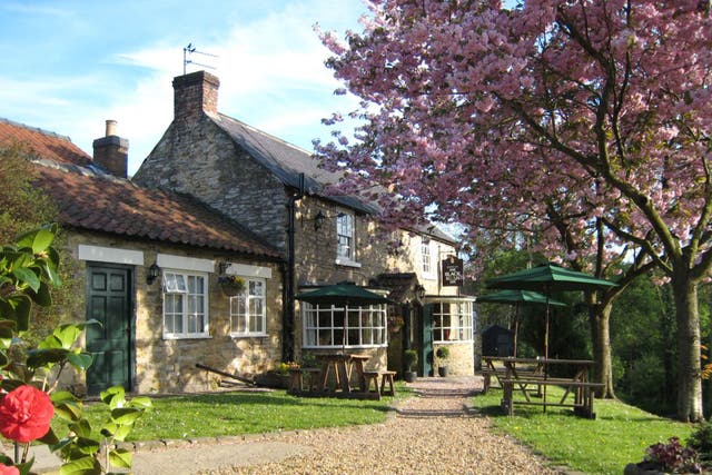 The old pub, built around the time that Henry VIII sacked the abbey, is embedded in the landscape