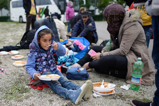 A young girl grubs at a refugee accommodation facility in Munich, Germany.