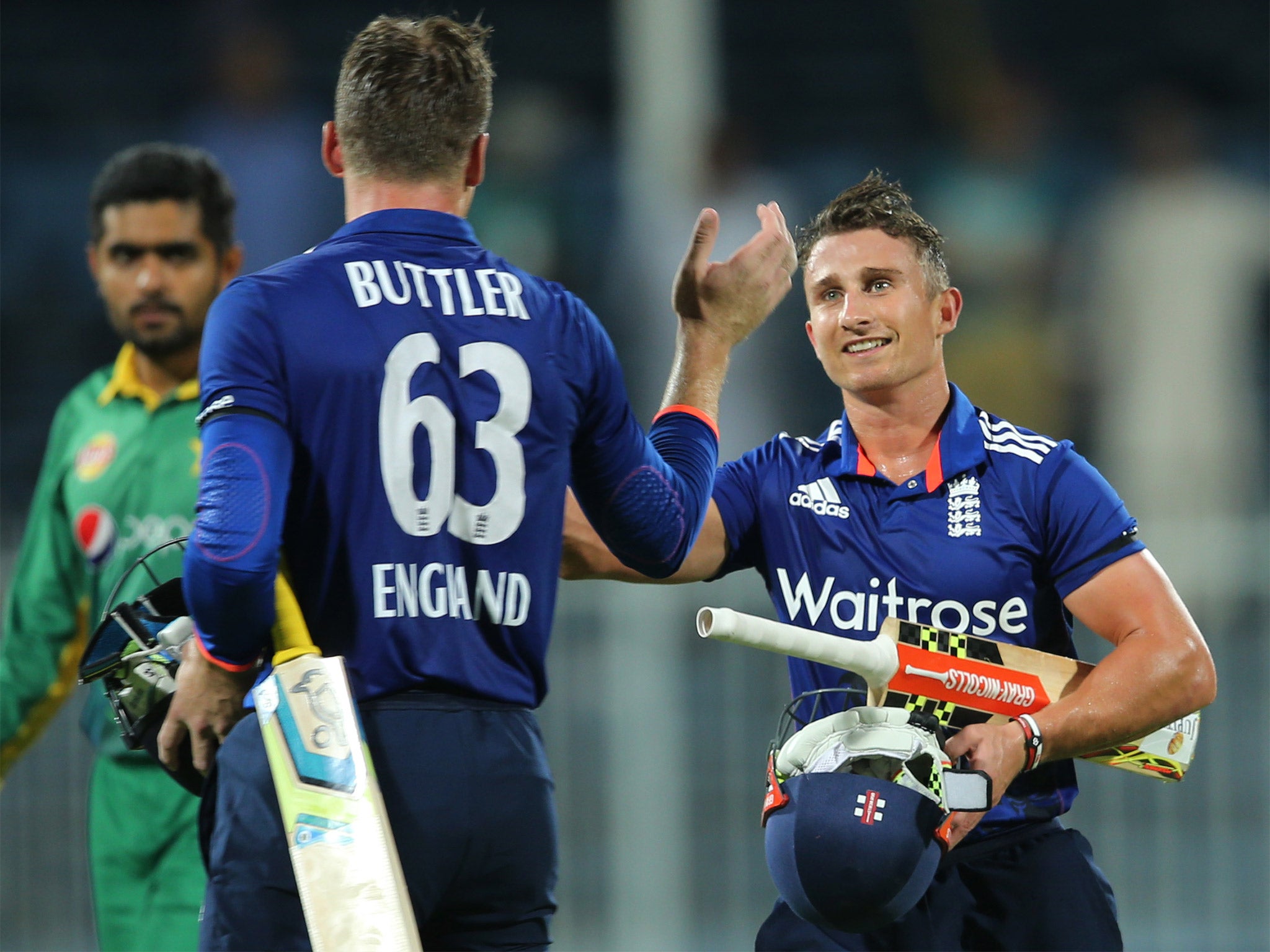 James Taylor, right, and Jose Buttler shake hands