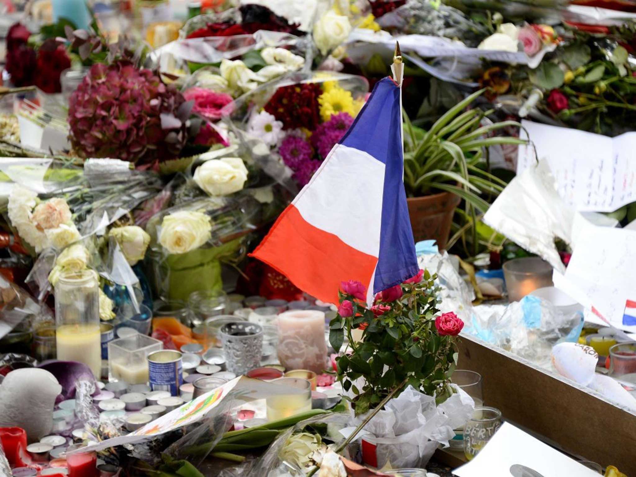 Tributes outside the Bataclan concert hall where 89 people were killed