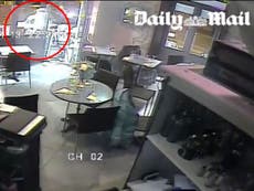 Paris CCTV shows woman's miraculous escape as attacker's gun jams