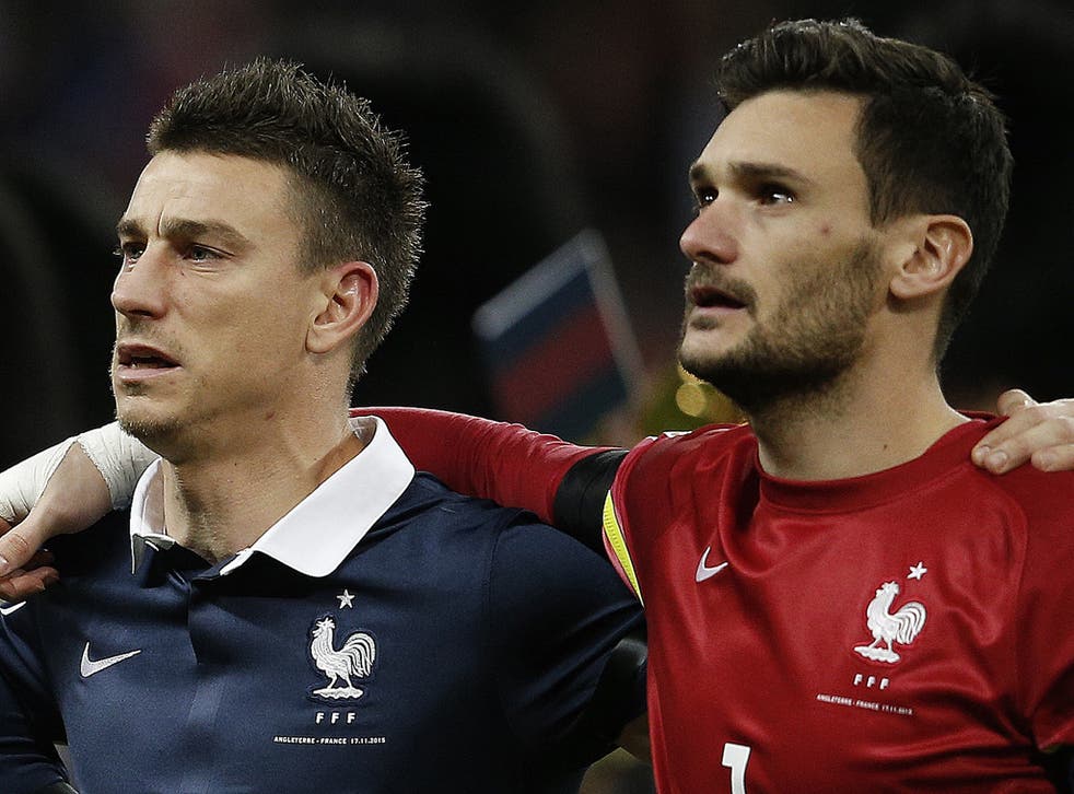 Laurent Koscielny, left, was visibly moved by the rendition of 'La Marseillaise' before Tuesday's match against England