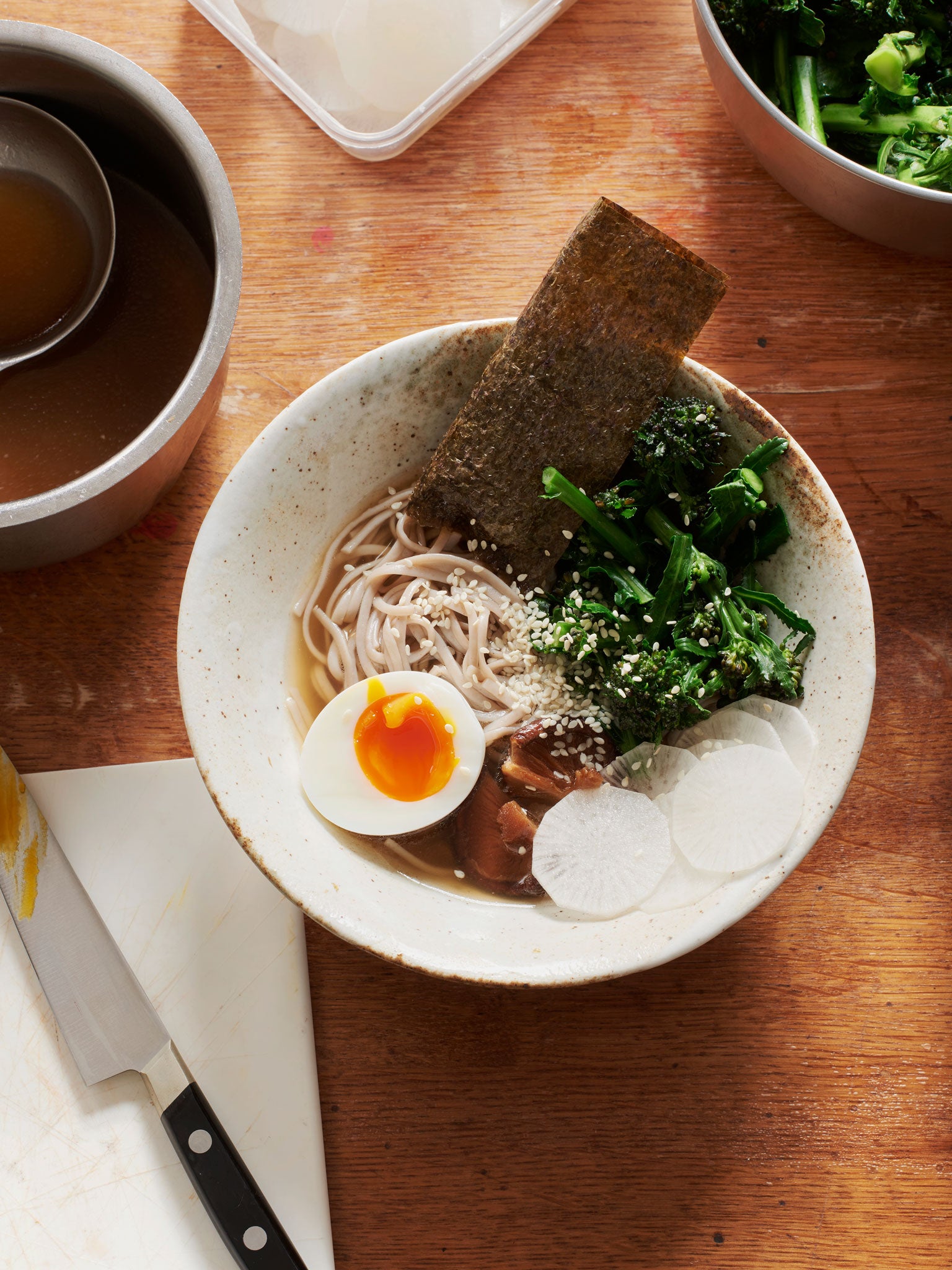 Buckwheat soba noodles with greens, shiitake, egg, mooli slices and nori