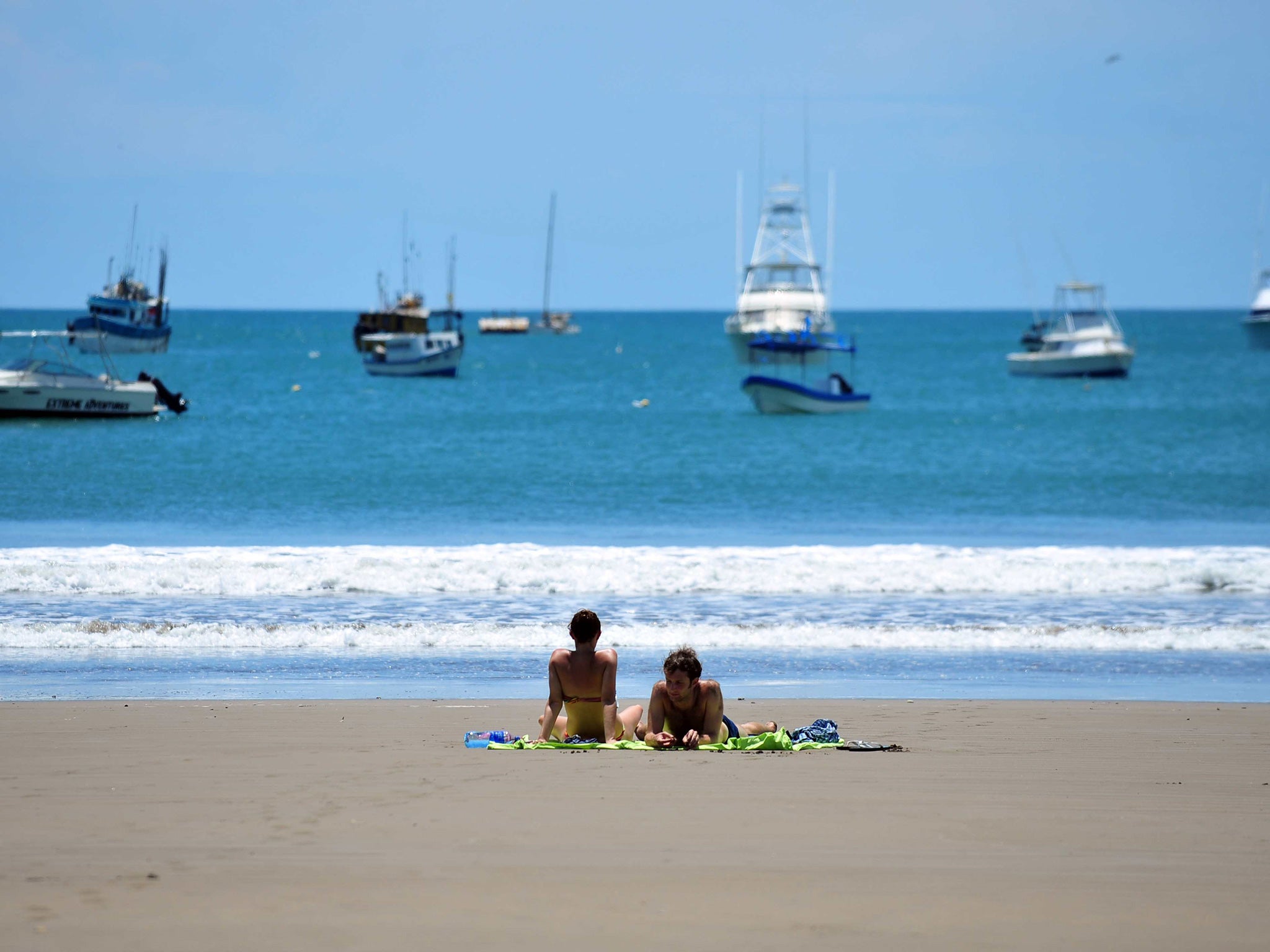 Tourists sunbath in San Juan del Sur beach in the south of Nicaragua