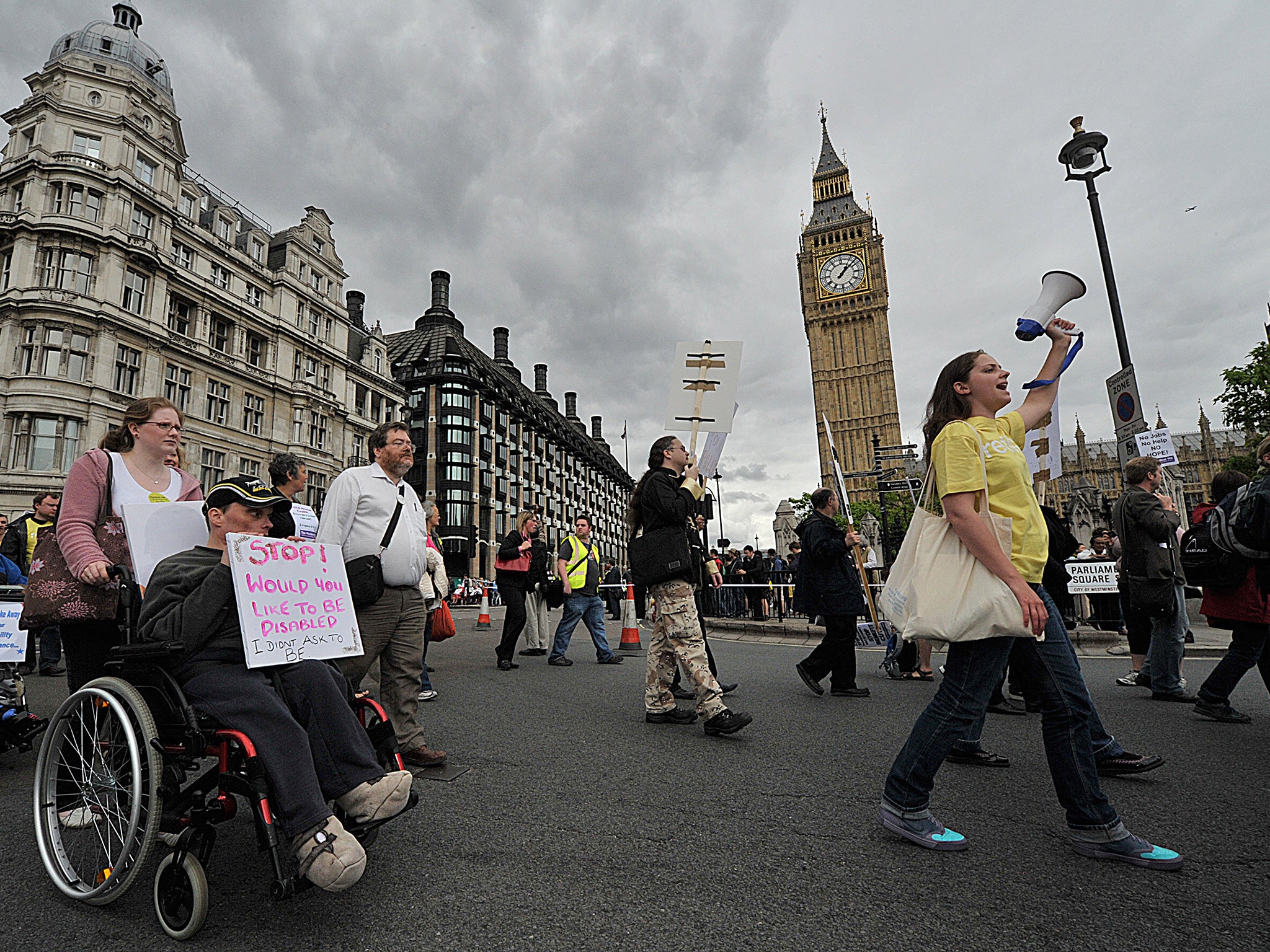 Disabled protestors demonstrate past the Houses of Parliament in 2011